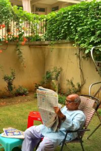 Reading a newspaper in the morning was his favourite activity