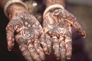 Getting henna is a tradition on Karva Chauth